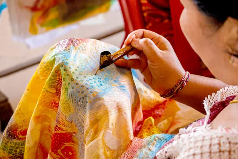 Lady making a batik