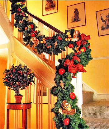 To top them all. Festive green swags can be bought ready-made. Twist them into shape and drape them over the top of the banisters, then add your own embellishments - fruits, berries, ribbon bows and other decorations.