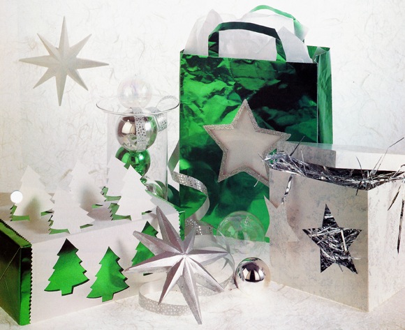 Sparkling Christmas wrap. Wrapped in dazzling Christmas colours of green and silver these presents look a million dollars, but will only take a little time and a few cents to produce. Transform plain carrier bags and boxes into expensive looking gifts everyone will want to unwrap. 
